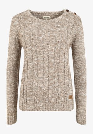 Pullover beige lavorato a maglia con motivo a treccia, scollatura rotonda e due bottoni decorativi sulla spalla sinistra. Etichetta del marchio visibile all'orlo.
