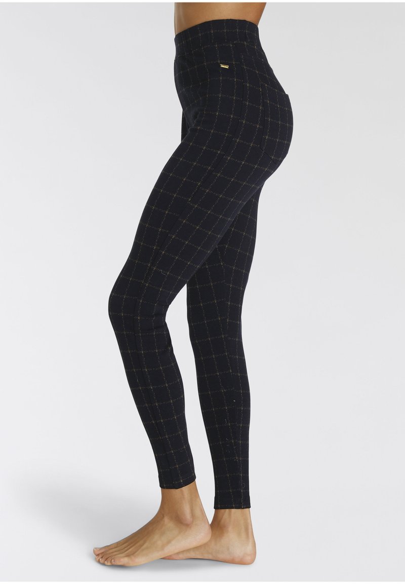 Marineblaue Leggings mit goldenem Gittermuster und hohem Bund, ausgestattet mit einer glatten Textur und enger Passform, geeignet für Sportbekleidung.