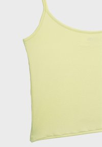 Débardeur jaune pâle sans manches avec fines bretelles, présenté à plat sur un fond neutre.