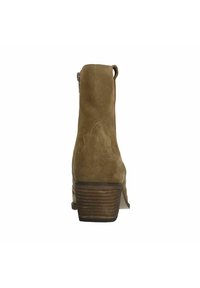 Brown suede ankle boots with a stacked heel, featuring a pointed toe and decorative stitching on the back. The design is minimalist and sleek.