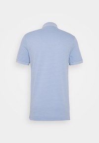 Light blue polo shirt with a striped pattern, short sleeves, and a classic collar. Material appears textured but smooth.