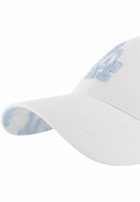 White baseball cap with a curved brim, featuring light blue embroidery on the front. Light blue patterned underside of the brim.