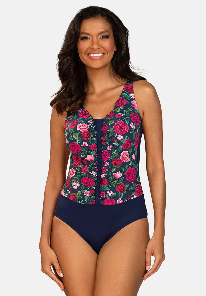 Kwiatowy jednoczęściowy kostium kąpielowy z różowymi i zielonymi wzorami róż na granatowym tle. Posiada detale z guzikami oraz regulowane ramiączka.