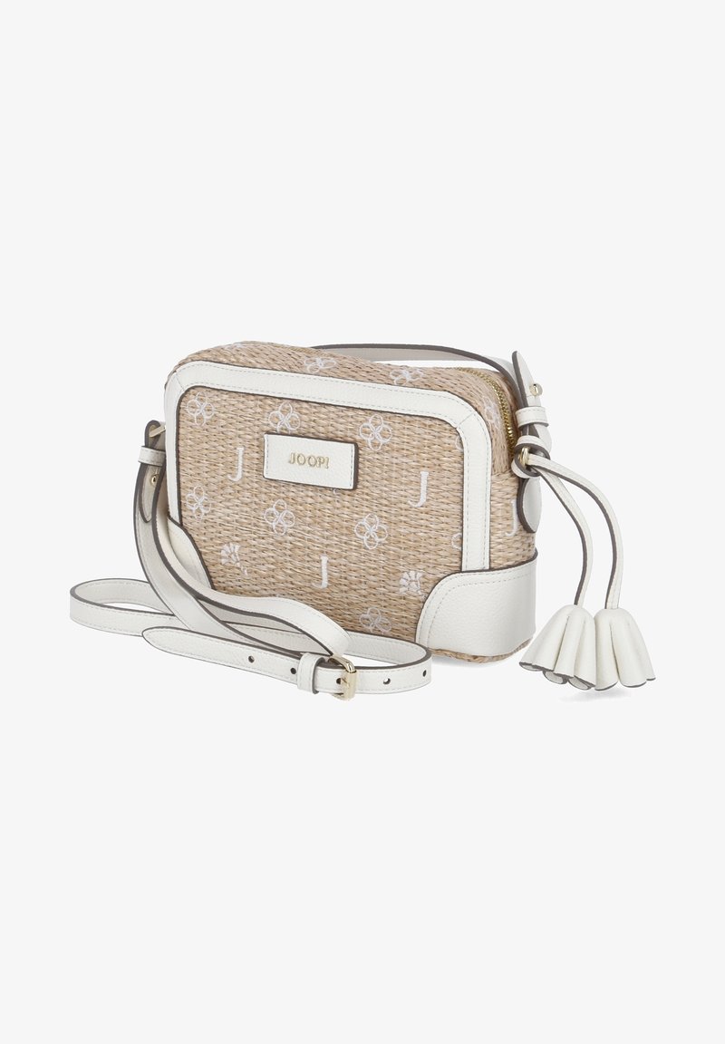 Tan woven bag with white leather accents and a floral pattern. Features a detachable strap and tassel detail. Gold brand logo on front.
