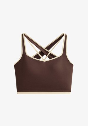 Brassière de sport marron avec bordure crème. Présente une coupe ajustée et des bretelles croisées. Fabriquée en tissu extensible. Texture lisse.