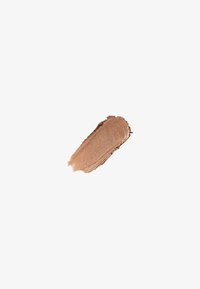 Bronze cream highlighter med en glat, reflekterende tekstur. Har en varm, metallisk glød i en flydende, forlænget form.