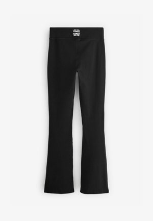 Zwarte wijde leggings gemaakt van rekbare stof. Kenmerken een effen kleur, brede tailleband en een minimalistisch ontwerp zonder zichtbare patronen.