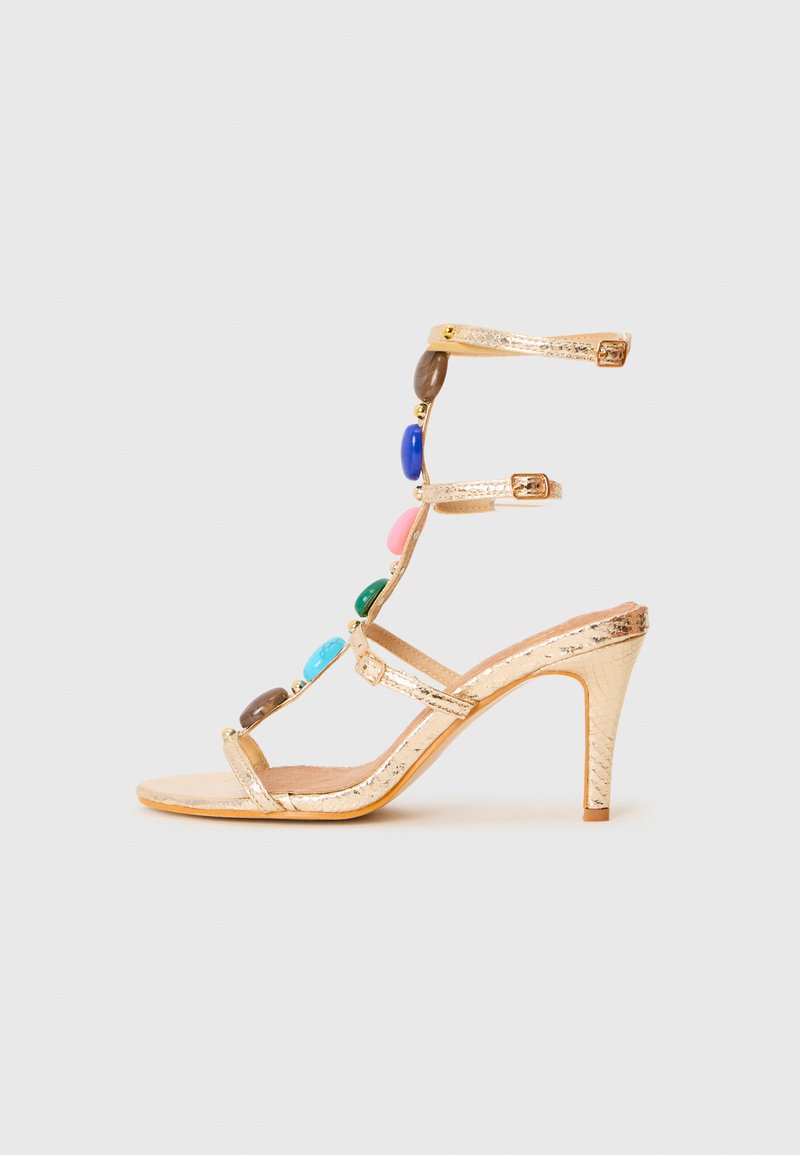 Cassis côte d’azur Sandalen met enkelbandjes goudkleurig