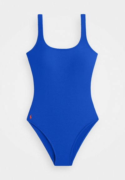 Blue one-piece swimsuit featuring a square neckline and narrow straps. Includes a small red logo on the lower left side. Smooth texture.