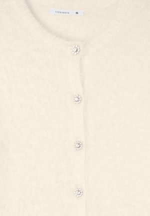 Cardigan crema realizzato in materiale morbido e peloso. Presenta bottoni simili a gioielli, scollatura rotonda e maniche a lunghezza completa. Etichetta di taglia S visibile.