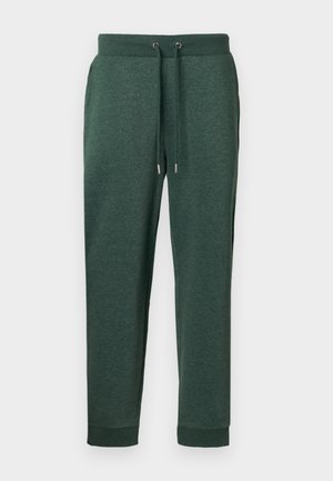 Pantalones deportivos de color verde oscuro con cintura ajustable mediante cordón, bolsillos laterales y puños acanalados, fabricados con una tela suave y texturizada.