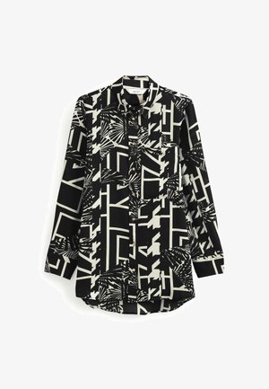 Zwart-wit blouse met lange mouwen en knopen, met geometrische en abstracte bladvormen, voorzien van een voorzak en kraag.