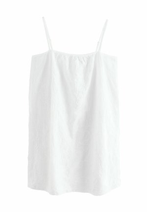 Camisole blanche sans manches avec des fines bretelles, présente un motif floral texturé et une coupe droite qui arrive au niveau des hanches.
