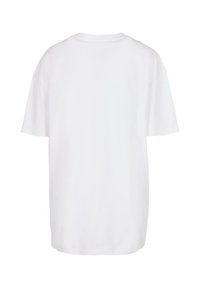 White cotton t-shirt with a crew neck, short sleeves, and a loose fit. The back is plain with no graphics or embellishments.