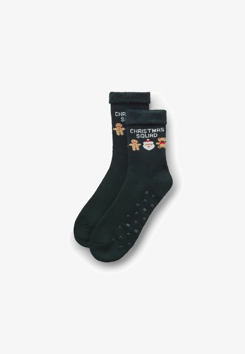 Dunkelgrüne, flauschige Socken mit dem Aufdruck "Christmas Squad", verziert mit Lebkuchenmännern und Weihnachtsmann-Grafiken sowie strukturierten, rutschfesten Sohlen.