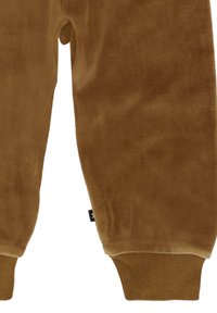 Bruine corduroy broek met elastische boorden en een gestructureerde oppervlakte. Opvallend zijnaadlabel, recht gesneden ontwerp en een zachte afwerking.