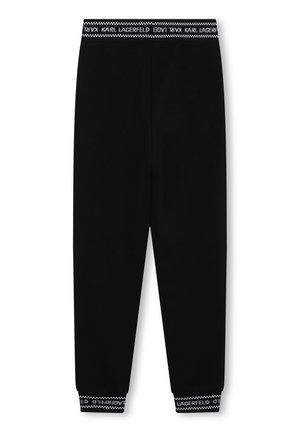 Zwarte taps toelopende sweatpants met een elastische tailleband en boorden met daarop de witte tekst "KARL LAGERFELD" en een zigzagpatroon.