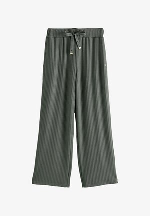 Szare szerokie spodnie z prążkowanej tkaniny z elastyczną talią, detalem w postaci wiązania oraz miękką strukturą. Posiadają małe logo marki z boku.