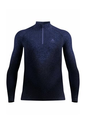 Haut à manches longues bleu marine avec col zippé, en tissu texturé présentant un motif subtil, coupe ajustée et une fermeture éclair unique au niveau du col.
