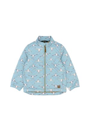 Svetlomodrá prešívaná bunda s motívom lebiek dlhých rohů, so zapínaním na celý zips, golierom a elastickými manžetami. Hnedá štítok značky na boku.