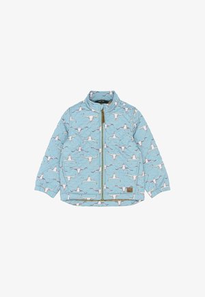 Svetlomodrá prešívaná bunda s motívom lebiek dlhých rohů, so zapínaním na celý zips, golierom a elastickými manžetami. Hnedá štítok značky na boku.