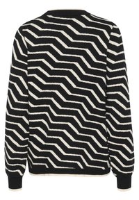 Black and white patterned sweater featuring a zigzag design, ribbed cuffs, and a crew neckline. Made of soft knit material.