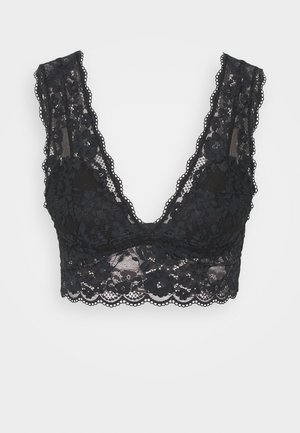 Black lace bralette with floral pattern, deep V neckline, wide lace straps, and scalloped edges, featuring a semi-sheer texture.