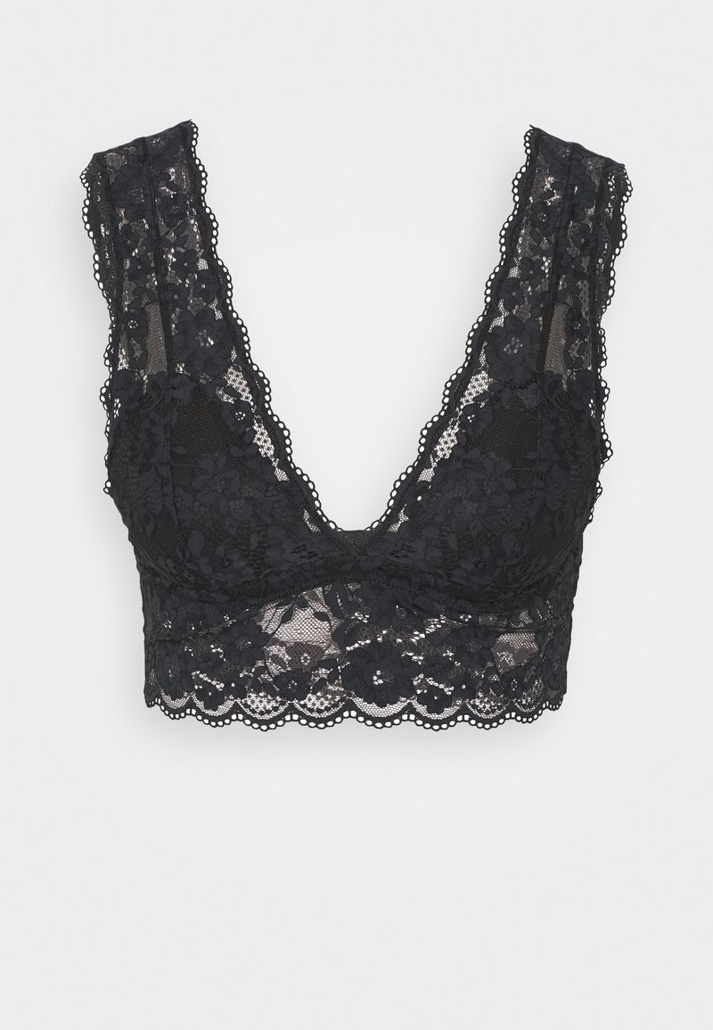 Bralette in pizzo nero con motivo floreale, scollatura a V profonda, spalline in pizzo larghe e bordi a scallop, caratterizzato da una texture semi-trasparente.