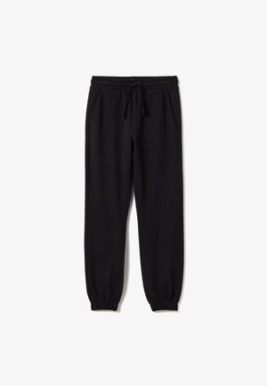 Pantalon de survêtement noir avec revers, taille élastique et cordon de serrage, doté de poches latérales, posé à plat sur fond blanc.