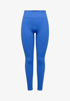 Helles blaue nahtlose Leggings mit hohem Bund und dezenten strukturierten Perforationsmustern an Beinen und Hüften.