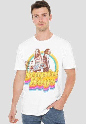 White cotton t-shirt featuring a colorful graphic of two figures with skateboards, text reading "Stupid Boys," and a rainbow design.