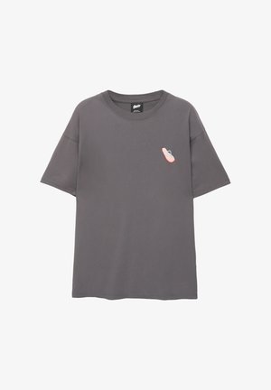 Gray cotton t-shirt with a relaxed fit, featuring a small pink and blue flip-flop graphic on the left chest area. Short sleeves, crew neck.