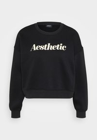 Sweatshirt nero croppato realizzato in materiale morbido, con una grafica testuale "Aesthetic" di colore crema sul davanti e polsini a costine.