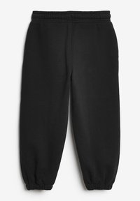 Schwarze Jogginghose mit elastischem Bund, schmal zulaufenden Bündchen und weicher Textur. Einfaches Design ohne zusätzliche Muster oder Hardware.