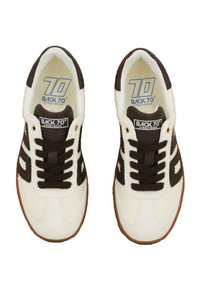 White and brown Back 70 streetwear sneakers with black laces, viewed from above on a white background.