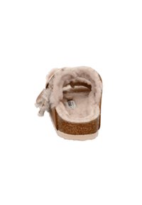 Brown cork slide sandal with a soft, light pink fuzzy lining, showing a rounded toe and flat sole. Adjustable strap on the side.