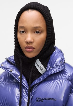 Purple puffer jacket with a glossy finish, featuring a black knit hood and drawstrings, and a logo on the left side.