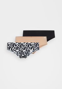 Tre par kvinnors underkläder: ett mönstrat i svart och vitt med logotyper, och två i enfärgat svart och nude, alla med sömlös design.