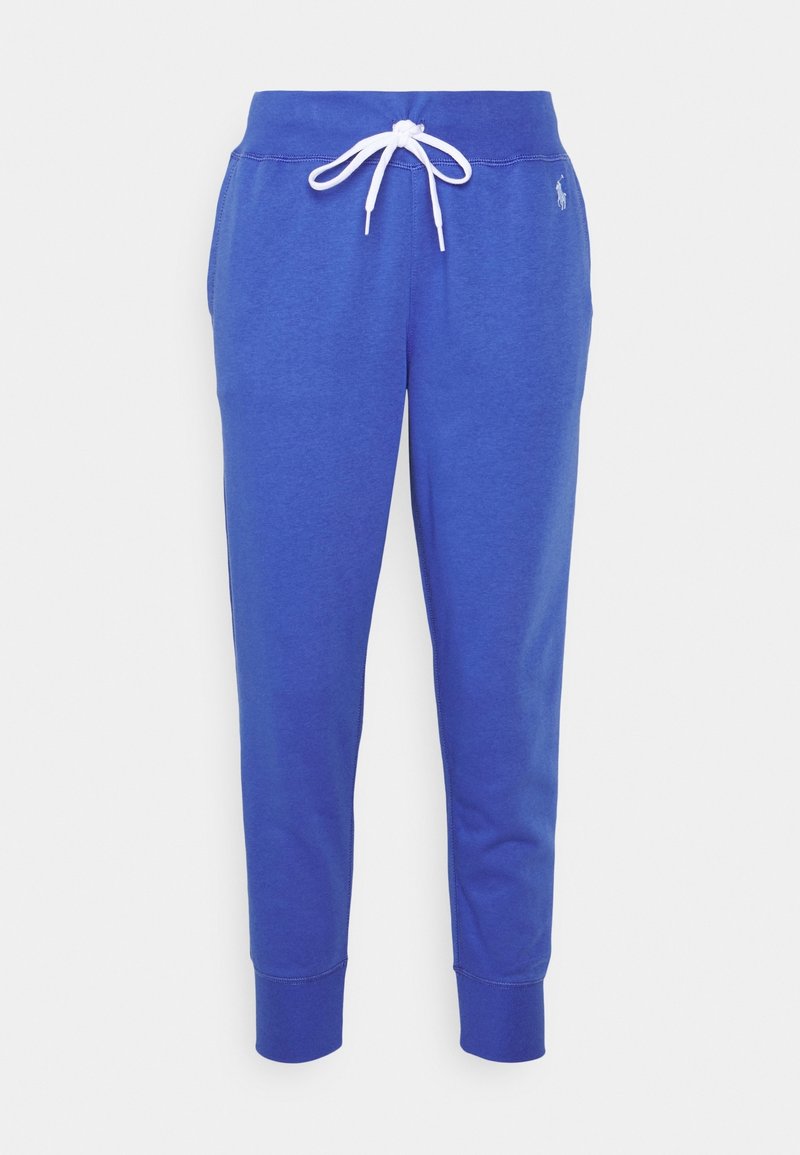 Blå bomullsträningsbyxor med en vit dragsko. Smalare benform med ribbade muddarna och en liten logotyp på övre vänstra sidan.