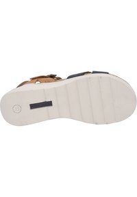 Brown and navy sandal with a textured sole and adjustable straps. Features a logo on the bottom and a cushioned footbed.