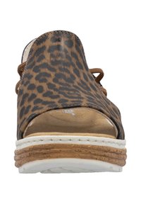 Brown and black leopard print sandal with open toe, leather upper, and lace details, featuring a layered cork and white sole.