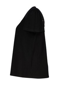 Haut noir à manches courtes en tissu texturé, à coupe ample, avec des accents décoratifs en œillets le long des bords des manches.