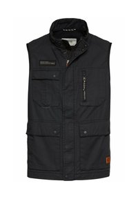 Schwarze ärmellose Weste aus strapazierfähigem Material, ausgestattet mit mehreren Taschen, einem hohen Kragen und einem Reißverschluss vorne; enthält ein Logo-Highlight.