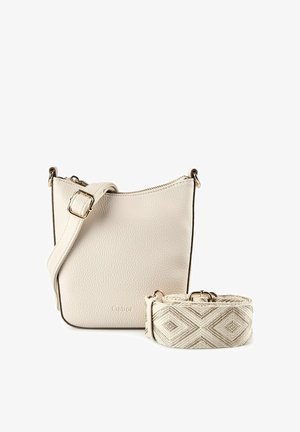 Small beige leather crossbody bag with adjustable strap attached and a separate patterned fabric strap beside it.