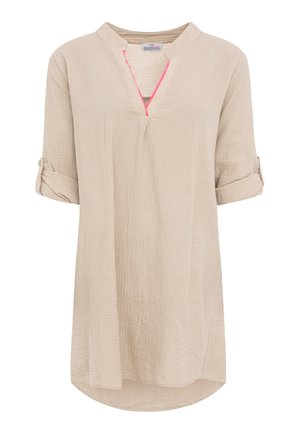 Beige textured tunic with rolled 3/4 sleeves, V-neckline with pink trim, and loose fit extending below hips.