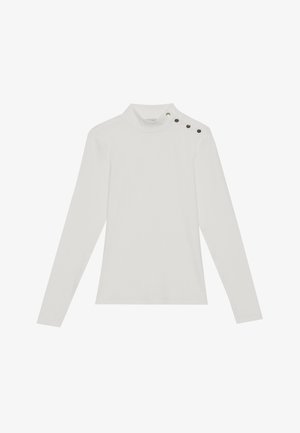 Valge pika varrukaga shirt kõrge kaelusega, millel on vasakul õlal kolm dekoratiivset musta nuppu, valmistatud pehmest ja venivast kangast.