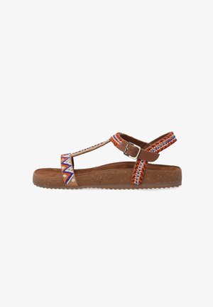 Brown sandals featuring beaded straps in orange, blue, and white. Soft material with textured sole and adjustable buckle for fit.