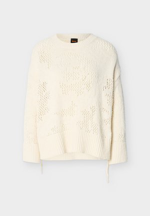 Pulover tricotat de culoare crem, cu decolteu rotund, mâneci lungi, manșete și tiv ribbed, având un model texturat subtil și detaliu cu șnur ajustabil.