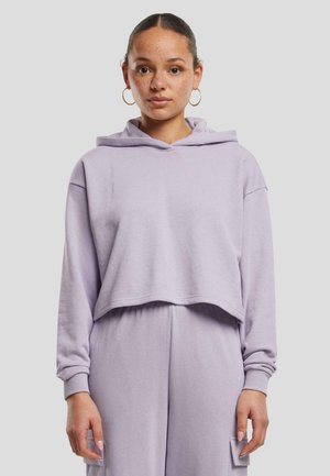 Lilla avkortet hettegenser laget av myk stoff med hette, løs passform og ribbede mansjetter. Har et avslappet design som passer for uformell bruk.