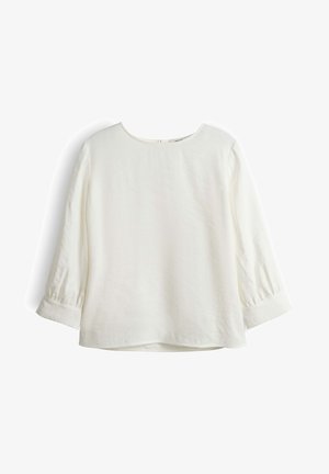 Weiße Bluse mit langen Ärmeln, rundem Ausschnitt und geknöpften Manschetten, flach auf einem weißen Hintergrund liegend dargestellt.